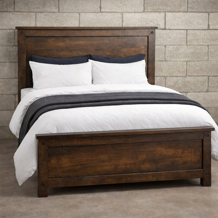 Handstone Adirondack Queen Panel Bed in wormy maple with a warm Sawmill Amber finish, featuring a substantial framed headboard and footboard, natural wood grain with a rough-sawn textured finish, rustic character, and dark metal accents.