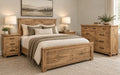 Handstone Adirondack bedroom set in wormy maple with a Sawmill Organic finish, featuring a wood bed, matching dresser, and three-drawer nightstands. Lighter natural wood tones highlight the distinctive sawmill texture, complemented by dark metal hardware and substantial framed construction.