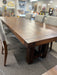Close-up view of the Balmoral dining table top in solid wormy maple with a rich Mocha stain, highlighting the detailed wood grain, rough-sawn finish and substantial tabletop edge.