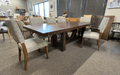 Balmoral 7-piece dining set featuring a solid wormy maple table in Mocha stain with a rough-sawn texture and 6 upholstered Tampa dining chairs with coordinating Mocha-finished wood legs and neutral textured fabric. Table shown with 1 of  its 2 end leaves inserted.