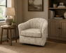 Darby swivel glide barrel chair shown in leafy taupe colored fabric upholstery