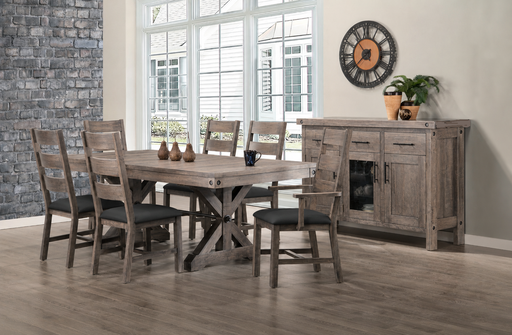 rustic dining room featuring a solid wood rectangular table with a trestle-style base, surrounded by 6 matching wooden chairs with dark upholstered seats. A coordinating sideboard sits against the wall to the right